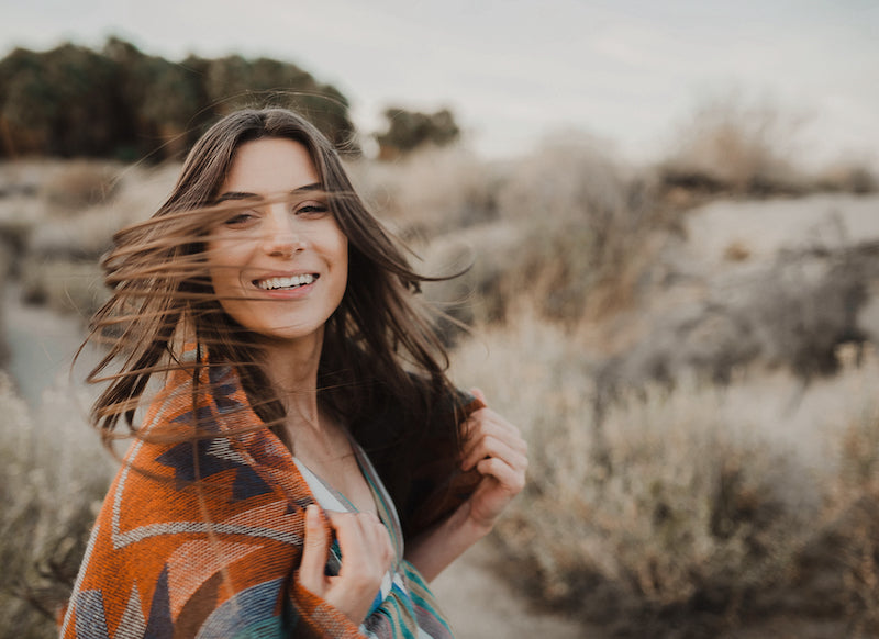 Gift card image, woman with long hair looking delighted at receiving a Lyonsleaf gift card