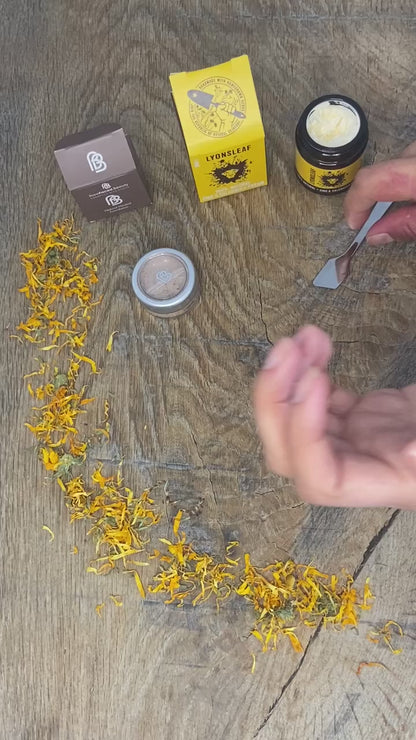 video shows zinc and calendula cream being mixed with mineral powder foundation in someones palm to make a liquid foundation